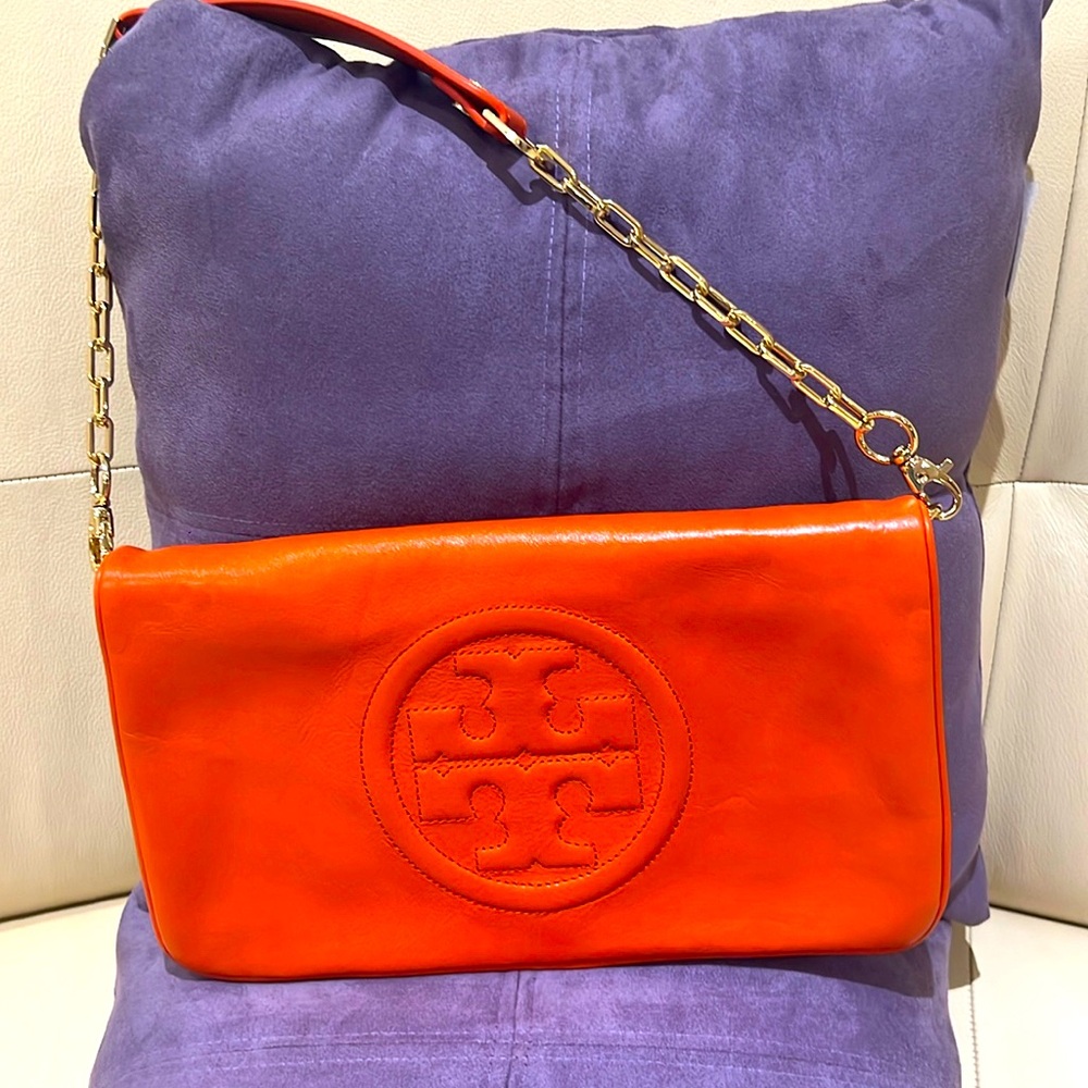 Brand new and authentic Tory Burch Bombe Reva Clutch that has never been used.